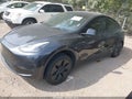 2024 Tesla Model Y — photo 2 of 18 | VIN 7SAYGDED2RF202597