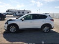 2016 Mazda CX-5 — photo 14 of 16 | VIN JM3KE2CY6G0747353