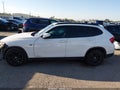 2014 BMW X1 — photo 14 of 16 | VIN WBAVM1C5XEVW49321