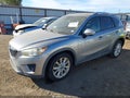2014 Mazda CX-5 — photo 2 of 17 | VIN JM3KE4DY9E0390547