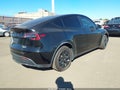 2023 Tesla Model Y — photo 4 of 18 | VIN 7SAYGDEEXPA027342
