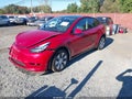 2023 Tesla Model Y — photo 2 of 19 | VIN 7SAYGDEE6PA091930