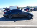 2016 Infiniti Q50 — photo 13 of 16 | VIN JN1FV7AR8GM450650