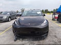 2025 Tesla Model Y — photo 11 of 18 | VIN 7SAYGDED3SF215199
