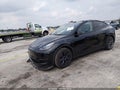 2025 Tesla Model Y — photo 2 of 18 | VIN 7SAYGDED3SF215199