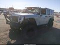 2012 Jeep Wrangler Unlimited — photo 2 of 12 | VIN 1C4BJWDG2CL217035