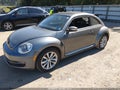 2014 Volkswagen Beetle — photo 2 of 11 | VIN 3VWRL7AT1EM638937