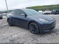 2024 Tesla Model Y — photo 1 of 18 | VIN 7SAYGDEE3RA277833
