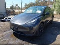 2024 Tesla Model Y — photo 2 of 17 | VIN 7SAYGAEE2RF030871