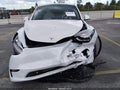 2023 Tesla Model Y — photo 11 of 17 | VIN 7SAYGDEE0PA161437