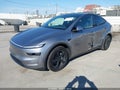 2026 Tesla Model Y — photo 2 of 20 | VIN 7SAYGAEE2TF691162