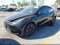 2024 Tesla Model Y — photo 2 of 17 | VIN 7SAYGDED6RF119058