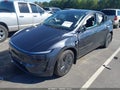 2026 Tesla Model Y — photo 2 of 15 | VIN 7SAYGDEE1TA410175