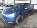2022 Tesla Model Y — photo 2 of 18 | VIN 7SAYGDEE2NF458676