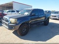 2014 Toyota Tacoma — photo 2 of 16 | VIN 3TMJU4GN4EM166382