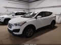 2016 Hyundai Santa Fe — photo 2 of 15 | VIN 5XYZTDLB5GG377947