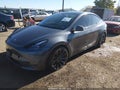 2023 Tesla Model Y — photo 2 of 19 | VIN 7SAYGDEF0PF962252