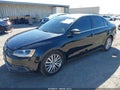 2014 Volkswagen Jetta — photo 2 of 11 | VIN 3VWD17AJ5EM431532