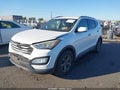 2015 Hyundai Santa Fe — photo 2 of 16 | VIN 5XYZU3LB0FG235978