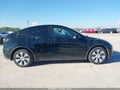 2023 Tesla Model Y — photo 13 of 18 | VIN 7SAYGDEE8PA111384