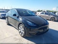 2023 Tesla Model Y — photo 1 of 18 | VIN 7SAYGDEE8PA111384