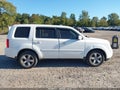 2012 Honda Pilot — photo 13 of 16 | VIN 5FNYF4H55CB075422