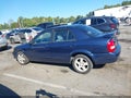 2000 Mazda Protege — photo 14 of 16 | VIN JM1BJ2211Y0266890
