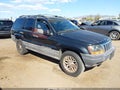 1999 Jeep Grand Cherokee — photo 1 of 11 | VIN 1J4GW58S6XC571026