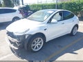 2021 Tesla Model Y — photo 2 of 19 | VIN 5YJYGDED0MF122088