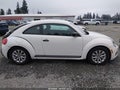 2013 Volkswagen Beetle — photo 13 of 17 | VIN 3VWFP7AT4DM654118