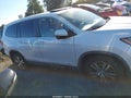 2017 Honda Pilot — photo 13 of 16 | VIN 5FNYF5H55HB030106
