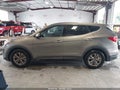2016 Hyundai Santa Fe — photo 14 of 16 | VIN 5XYZT3LB2GG340204