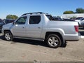 2009 Honda Ridgeline — photo 14 of 16 | VIN 5FPYK16559B109176