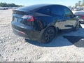 2025 Tesla Model Y — photo 4 of 15 | VIN 7SAYGAEE7SF217724