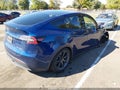 2025 Tesla Model Y — photo 4 of 14 | VIN 7SAYGAEE2SF296638