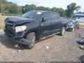 2014 Toyota Tundra — photo 2 of 15 | VIN 5TFDW5F11EX386102
