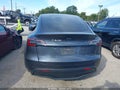 2022 Tesla Model Y — photo 15 of 17 | VIN 7SAYGDEE3NA009827
