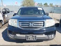 2014 Honda Pilot — photo 12 of 16 | VIN 5FNYF4H21EB025450