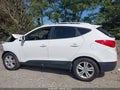 2013 Hyundai Tucson — photo 13 of 15 | VIN KM8JU3AC0DU637841