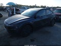 2026 Tesla Model Y — photo 2 of 15 | VIN 7SAYGDEE9TA670646