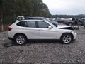 2014 BMW X1 — photo 13 of 16 | VIN WBAVM1C57EVW52791