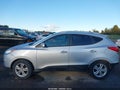 2013 Hyundai Tucson — photo 14 of 16 | VIN KM8JUCAC6DU736843