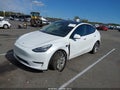 2023 Tesla Model Y — photo 2 of 15 | VIN 7SAYGDEF4PA049832
