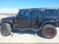 2019 Jeep Wrangler Unlimited — photo 14 of 16 | VIN 1C4HJXFN0KW521036