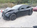 2024 Tesla Model Y — photo 2 of 15 | VIN 7SAYGDED1RA332898