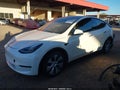 2022 Tesla Model Y — photo 2 of 17 | VIN 7SAYGDEF4NF347314