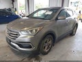 2017 Hyundai Santa Fe — photo 2 of 16 | VIN 5XYZT3LBXHG411084