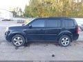 2013 Honda Pilot — photo 14 of 17 | VIN 5FNYF4H52DB504548