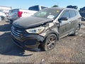 2014 Hyundai Santa Fe — photo 2 of 16 | VIN 5XYZT3LB2EG175042