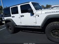 2011 Jeep Wrangler Unlimited — photo 13 of 17 | VIN 1J4BA3H18BL602807
